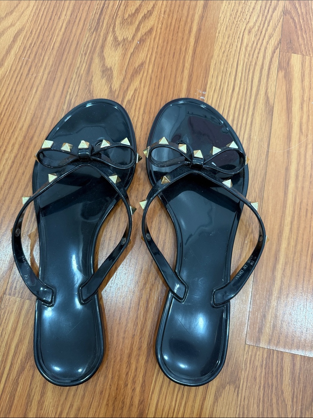 Black Jelly Sandals with Gold Pyramid Studded Bow